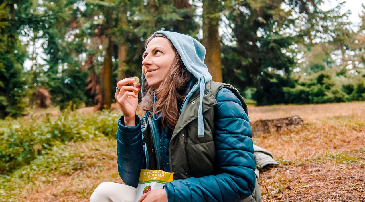 Woman eating freeze dried fruit snacks